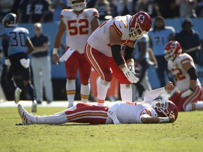 Kansas City Chiefs quarterback Patrick Mahomes takes a moment on the turf to gather his thoughts after taking a hit on a fourth-down play against the Tennessee Titans during the second half at Nissan Stadium.