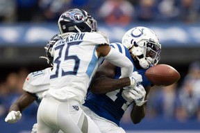 Tennessee Titans defensive back Chris Jackson (35) knocks the ball out of Indianapolis Colts wide receiver Zach Pascal (14) hands in the second half at Lucas Oil Stadium. *(Trevor Ruszkowski-USA TODAY Sports)
