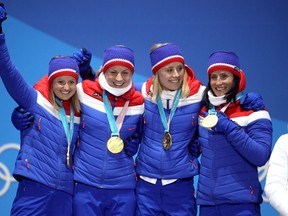 Gold medalists Ingvild Flugstad Oestberg, Astrid Uhrenholdt Jacobsen, Ragnhild Haga and Marit Bjoergen of Norway celebrate during the medal ceremony for the Cross-Country Skiing - Ladies' 4x5km Relay on nine one of the PyeongChang 2018 Winter Olympic Games at Medal Plaza on February 18, 2018 in Pyeongchang-gun, South Korea.