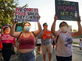 Supporters of reproductive choice take part in the nationwide Women's March, held after Texas rolled out a near-total ban on abortion procedures and access to abortion-inducing medications, in Brownsville, Texas, Oct. 2, 2021.