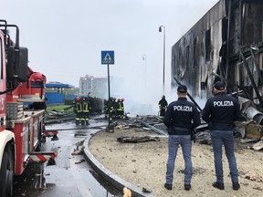 This handout picture made available by the Italy's Polizia di Stato shows the site of a plane crash in the Milan suburb of San Donato on October 3, 2021.