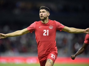 Canada's Jonathan Osorio celebrates after scoring against Mexico during their Qatar 2022 FIFA World Cup Concacaf qualifier match at the Azteca Stadium, in Mexico City, on October 7, 2021.