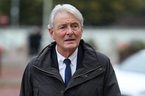 David Henderson arrives at the Cardiff Crown Court on October 18, 2021 to be tried in connection with the plane crash that killed footballer Emiliano Sala.