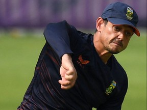 South Africa's Quinton De Kock throws the ball during a practice session ahead of the ICC men's Twenty20 World Cup cricket match between South Africa and West Indies at the Sheikh Zayed Cricket Stadium in Abu Dhabi on October 25, 2021.