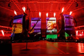 A video tribute to drummer Charlie Watts plays before the Rolling Stones took the stage in St. Louis last month.