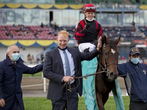 Dylan Davis guides Mutamakina (GB) to victory in the $600,000 dollar E.P.Taylor Stakes at Woodbine. Mutamakina is owned by Al Shira'aa Farms and trained by Christophe Clement.