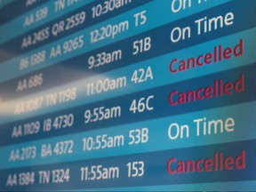 A screen showing cancelled flights is seen at Los Angeles International Airport as more than 1,400 American Airlines flights over the weekend have been cancelled due to staff shortages and unfavourable weather in Los Angeles, Calif., Oct. 31, 2021.