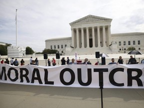 Anti-abortion activists demonstrate outside the U.S. Supreme Court in Washington, D.C., Oct. 4, 2021.