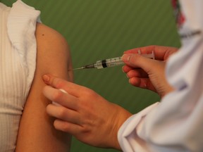 A nurse receives a dose of the Sinovac's coronavirus disease (COVID-19) vaccine, after Brazil health regulator Anvisa approved its emergency use at Hospital das Clinicas in Sao Paulo, Brazil January 17, 2021.
