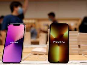 Apple's iPhone 13 models are pictured at an Apple Store the day the new Apple iPhone 13 series goes on sale, in Beijing, Sept. 24, 2021.