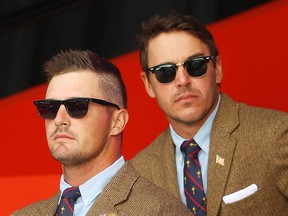 Bryson DeChambeau and Brooks Koepka of the United States attend the opening ceremony for the 43rd Ryder Cup at Whistling Straits on September 23, 2021 in Kohler, Wisconsin.
