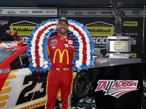 Bubba Wallace, driver of the #23 McDonald's Toyota, celebrates in the victory lane after winning the rain-shortened NASCAR Cup Series YellaWood 500 at Talladega Superspeedway in Talladega, Ala., Monday, Oct. 4, 2021.