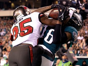 Tampa Bay Buccaneers cornerback Jamel Dean (35) breaks up a pass play to Philadelphia Eagles wide receiver Quez Watkins (16) in the end zone at Lincoln Financial Field.