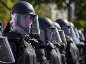 United States Capitol Police in riot gear stand after a rally at freedom plaza March October 2, 2021 in Washington, DC.