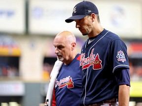 Charlie Morton of the Atlanta Braves is taken out of the game against the Houston Astros at Minute Maid Park on October 26, 2021 in Houston, Texas.