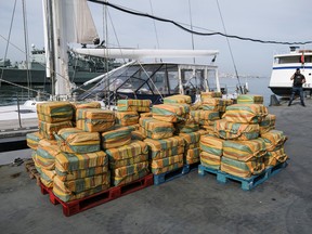 Cloth sacks of cocaine are seen during a Portuguese and Spanish police news conference presenting the 5.2 tons of cocaine seized in the Atlantic Ocean, in Almada, Portugal, October 18, 2021.