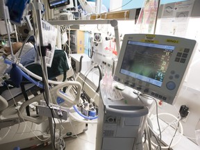 A patient is attached to a ventilator in the COVID-19 intensive care unit at St. Paul's hospital in downtown Vancouver, April 21, 2020.