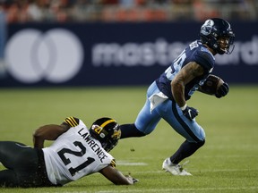 Toronto Argonauts running back D.J. Foster, avoiding a tackle by Tiger-Cats linebacker Simoni Lawrence  on Friday, Sept. 10, 2021, will have some hlp in the running back department for Monday's rematch in Hamilton with A.J. Ouelette returning to active duty.


.