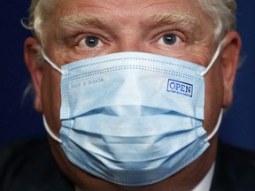 Ontario Premier Doug Ford wears a mask during a press conference at Queen's Park in Toronto, Wednesday, Sept. 22, 2021.