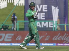 South Africa's Quinton de Kock walks from the field after he was dismissed during the Cricket Twenty20 World Cup match between South Africa and Australia in Abu Dhabi, UAE, Saturday, Oct. 23, 2021.