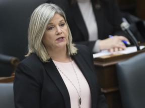 NDP Leader Andrea Horwath, left, asks Ontario Premier Doug Ford questions in the legislature at Queen's Park in Toronto on May 12, 2020.