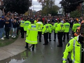 A police officer was taken to hospital for treatment of undisclosed injuries after being hit with some form of projectile during Queen's University's unofficial homecoming weekend.