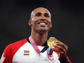 Tokyo 2020 Olympics - Athletics - Men's Decathlon - Medal Ceremony - Olympic Stadium, Tokyo, Japan - August 6, 2021. Canadian Damian Warner shows off the gold medal he won in the Men's Decathlon at the Tokyo Olympics.