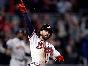 Dansby Swanson of the Atlanta Braves celebrates as he rounds the bases after hitting a solo home run against the Houston Astros during the seventh inning in Game Four of the World Series at Truist Park on Oct. 30, 2021 in Atlanta, Ga.