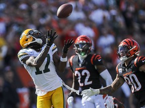 Green Bay Packers wide receiver Davante Adams (17) catches a pass against Cincinnati Bengals safety Jessie Bates III (30) in the second half at Paul Brown Stadium.