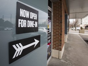 A sign poins to dine-in restaurant service at a plaza at the corner of Steeles Ave. W. and Dufferin St. in Vaughan on Thursday, March 11, 2021.