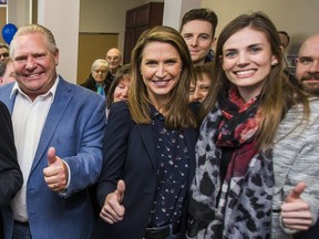 Doug Ford, Caroline Mulroney, centre,  and Lindsey Park are pictured at the official opening of the campaign office for Ajax Ontario PC candidate Rod Phillips in Ajax, Ont. on Saturday, March 24, 2018.