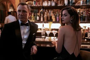 James Bond (Daniel Craig) and Paloma (Ana de Armas) in a scene from 'No Time to Die.'