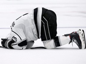 Kings defenceman Drew Doughty lays on the ice after being tripped in a game against the Stars in the second period at American Airlines Center in Dallas, Oct. 22, 2021.