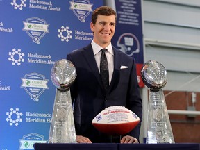 Eli Manning of the New York Giants poses with the Vince Lombardi trophies after a press conference to announce his retirement on January 24, 2020 at Quest Diagnostic Training Center in East Rutherford, New Jersey.