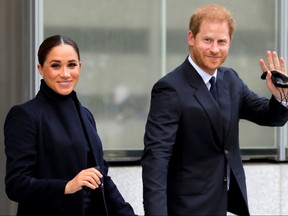 Prince Harry and Meghan, Duke and Duchess of Sussex, wave as they visit One World Trade Center in Manhattan September 23, 2021.