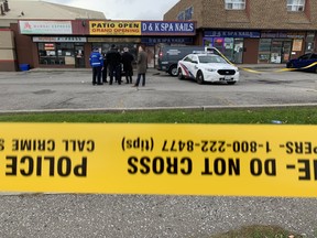 Toronto Police investigators at the scene of a fatal shooting in Scarborough at Kennedy and Ellesmere Rds. on Friday, Oct. 29, 2021.