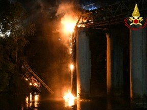 A fire engulfs iconic "Iron Bridge" in Rome,  Oct. 3, 2021.
