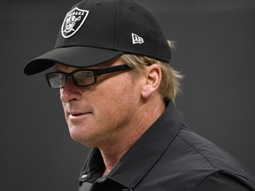 Coach Jon Gruden of the Las Vegas Raiders walks onto the field before a game against the Chicago Bears at Allegiant Stadium on October 10, 2021 in Las Vegas.