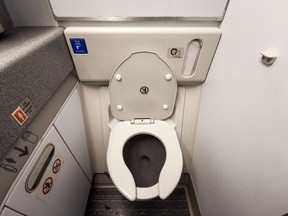 Inside Airplane lavatory.
