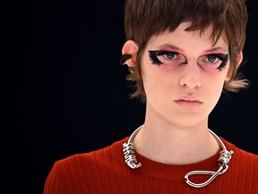 A model presents a creation, wearing a noose necklace, for Givenchy during the Women's Spring-Summer 2022 Ready-to-Wear collection fashion show in Paris La Defense, Nanterre, as part of the Paris Fashion Week, on October 3, 2021.