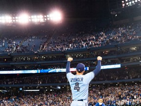 George Springer of the Blue Jays salutes the crowd after defeating the Baltimore Orioles in at the Rogers Centre on Sunday, Oct. 3, 2021 in Toronto.