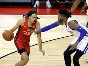 Dalano Banton #45 of the Toronto Raptors is guarded by Justin Patton #50 of the New York Knicks during the 2021 NBA Summer League at the Thomas & Mack Center on August 8, 2021 in Las Vegas, Nevada.