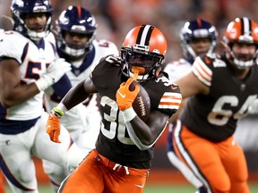 Running back D'Ernest Johnson #30 of the Cleveland Browns runs with the ball after taking a first quarter pass against the Denver Broncos at FirstEnergy Stadium on October 21, 2021 in Cleveland, Ohio.
