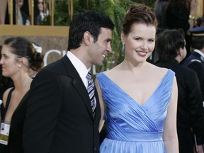 Actress Geena Davis and her husband Reza Jarrahy arrive on the red carpet of the Golden Globes Awards in Beverly Hills Jan. 15, 2007.
