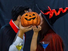 couple Young men are having fun drinking and celebrating the Halloween party.