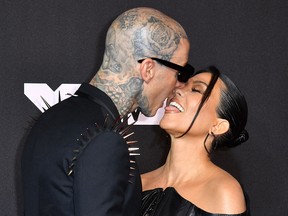 Travis Barker and Kourtney Kardashian arrive for the 2021 MTV Video Music Awards at Barclays Center in Brooklyn, New York, September 12, 2021.