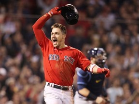 Enrique Hernandez of the Boston Red Sox celebrates his game winning sacrifice fly in the ninth inning against the Tampa Bay Rays during Game 4 of the American League Division Series at Fenway Park on Oct. 11. GETTY IMAGES