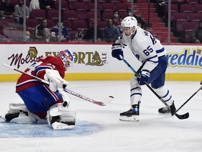 Montreal Canadiens goalie Jake Allen (34) makes a save against Toronto Maple Leafs forward Ilya Mikheyev (65) during the first period at the Bell Centre Sept. 27, 2021.