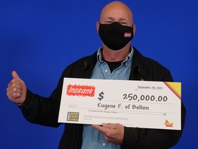 Eugene Fradsham, of Bolton, with his $250,000 winnings.