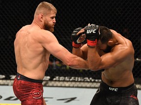 Jan Blachowicz (left) punches Dominick Reyes in their light heavyweight championship bout during UFC 253 inside Flash Forum on UFC Fight Island on September 27, 2020 in Abu Dhabi, United Arab Emirates.